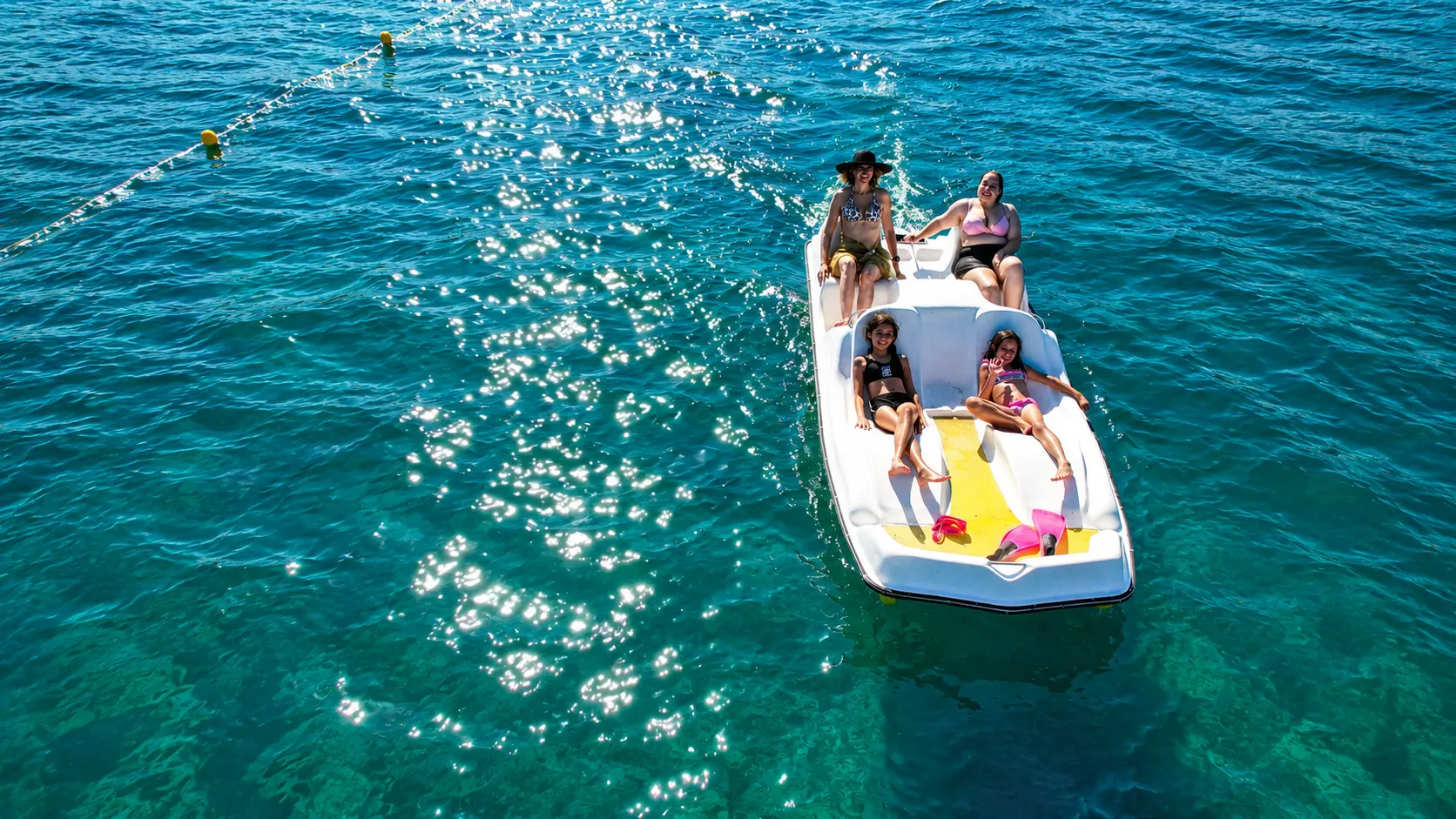Family pedalo on Afandou Beach ready for a shore session